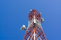 Mobile phone communication antenna tower with satellite dish on Royalty Free Stock Photo