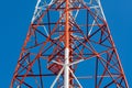 Mobile phone communication antenna tower with satellite dish on Royalty Free Stock Photo
