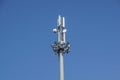 Mobile phone communication antenna tower with satellite dish on blue sky background, Telecommunication tower Royalty Free Stock Photo