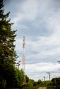 Mobile phone communication antenna tower with sky and clouds.New 5G radio network telecommunication equipment with radio Royalty Free Stock Photo