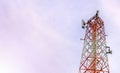 Mobile phone communication and network signal repeater antenna tower with blue sky background. With copy space for text or design Royalty Free Stock Photo