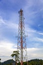 Mobile phone communication and network signal repeater antenna tower with blue sky background Royalty Free Stock Photo