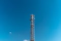 Mobile phone communication tower transmission signal with blue sky background and antenna, copy space Royalty Free Stock Photo