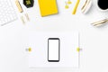 Mobile phone on designer workplace mockup top view