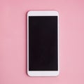 Mobile phone device and copy space on pink background