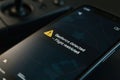 A mobile phone displays a geofence alert with a warning message, indicating restricted drone flight in the current location Royalty Free Stock Photo