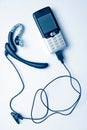 Mobile phone and handsfree Royalty Free Stock Photo