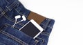 Mobile phone with headphone in your back pocket jeans Royalty Free Stock Photo