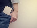 Mobile phone in jeans pocket Royalty Free Stock Photo