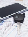 Mobile phone and key car on the map. Royalty Free Stock Photo