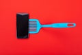 Top view of smart phone as part of cooking equipment in kitchen isolated on red background