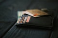 A Mobile Phone Laying On A Leather Purse And Small Stack Of Coins Royalty Free Stock Photo