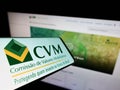Mobile phone with logo of Brazilian Comissao de Valores Mobiliarios (CVM) on screen in front of website. Royalty Free Stock Photo