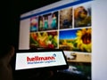 Mobile phone with logo of German multinational logistics company Hellmann Worldwide Logistics.