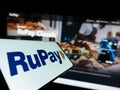 Mobile phone with logo of Indian payment system RuPay on screen in front of website. Royalty Free Stock Photo