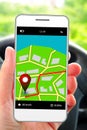 Mobile phone in man's hand with gps application Royalty Free Stock Photo
