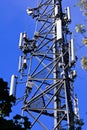 Mobile phone mast antenna, blue sky background Royalty Free Stock Photo