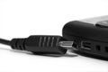Mobile phone and mini usb cable Royalty Free Stock Photo