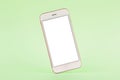 Mobile phone mock up on green pastel background, technology and busiess concept Royalty Free Stock Photo