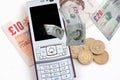Mobile phone and money Royalty Free Stock Photo