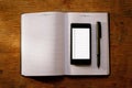 Mobile phone on an open diary or journal Royalty Free Stock Photo