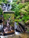 mobile phone photos taking pictures of nature and waterfalls. Royalty Free Stock Photo