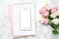 Mobile phone with pink and white roses flowers on marble background.Minimalistic composition for the holidays,valentines Royalty Free Stock Photo