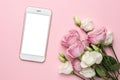 Mobile phone with pink and white roses flowers on pastel background.Minimalistic composition for the holidays,valentines day and Royalty Free Stock Photo