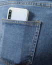 A mobile phone in the pocket of his blue jeans Royalty Free Stock Photo