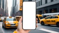 Mobile phone screen mockup in hand for calling, ordering taxi app in city street Royalty Free Stock Photo