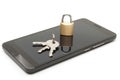 Mobile phone security and data protection concept. Smartphone with small lock and keys over it