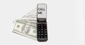 Mobile phone with text Call me. There are dollars nearby on a white background Royalty Free Stock Photo