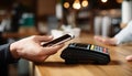 Mobile phone, touch a credit card reader on the counter bar. Royalty Free Stock Photo