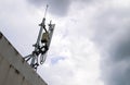 Mobile phone transmitter antenna on sky with many clouds Royalty Free Stock Photo