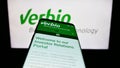 Mobile phone with webpage of biofuel company Verbio Vereinigte Bioenergie AG on screen in front of logo. Royalty Free Stock Photo