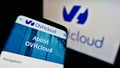 Mobile phone with webpage of French cloud computing company OVH Groupe SAS on screen in front of business logo.