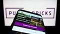 Mobile phone with webpage of real estate company Purplebricks Group plc on screen in front of business logo. Royalty Free Stock Photo