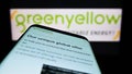 Mobile phone with website of French energy company GreenYellow SAS on screen in front of business logo. Royalty Free Stock Photo