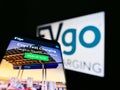 Mobile phone with website of US electric vehicle (EV) charging provider EVgo Services LLC on screen with logo.