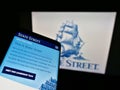 Mobile phone with website of US financial services company State Street Corporation on screen in front of logo.