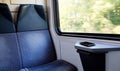 Mobile phone on window seat in a modern comfortable train Royalty Free Stock Photo