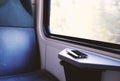 Mobile phone on window seat in a modern comfortable train Royalty Free Stock Photo