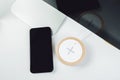 Mobile phone and wireless charger on office table Royalty Free Stock Photo