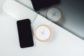 Mobile phone and wireless charger on office table Royalty Free Stock Photo