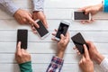 Mobile phones in friends hand Royalty Free Stock Photo