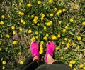 Mobile photo feemale feet pink snikerses yellow dandelions