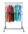 Mobile rack with clothes on white background. Royalty Free Stock Photo