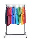 Mobile rack with color clothes on white background. File contains a path to isolation. Royalty Free Stock Photo