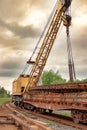 Mobile railway crane on a platform. Replacement and repair of railroad sleepers and other elements. Repair and reconstruction of Royalty Free Stock Photo