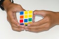 Mobile Rubik`s cube on a white background with expertise. And h